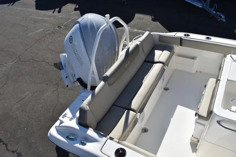 Slide: The Image of 2024 Key West 239 FS boat with Yamaha outboard motor and cushioned seating. - 10