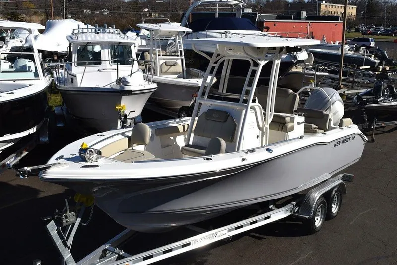 Slide: The Image of 2024 Key West 239 FS boat on a trailer in a marina. - 3