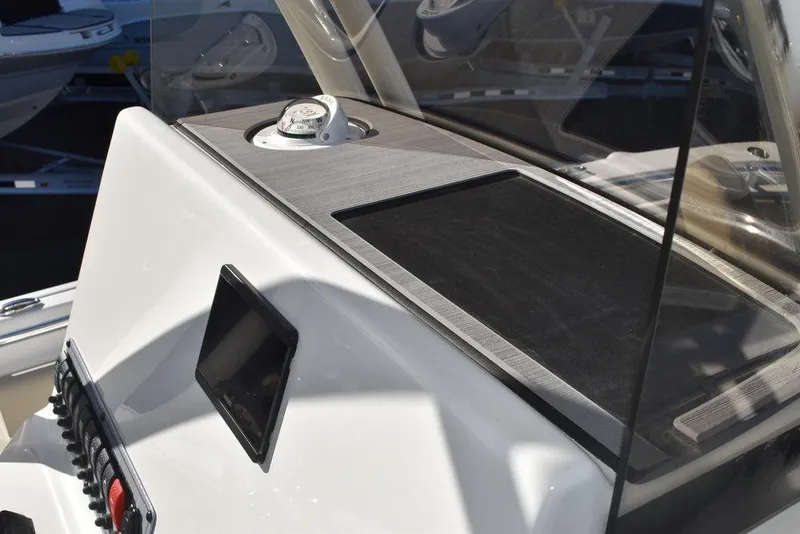 Slide: The Image of 2024 Key West 239 FS boat console with compass and display screen. - 34