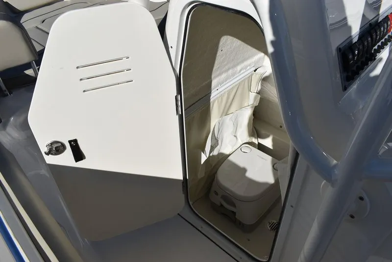 Slide: The Image of 2024 Key West 239 FS boat interior with open storage compartment. - 38