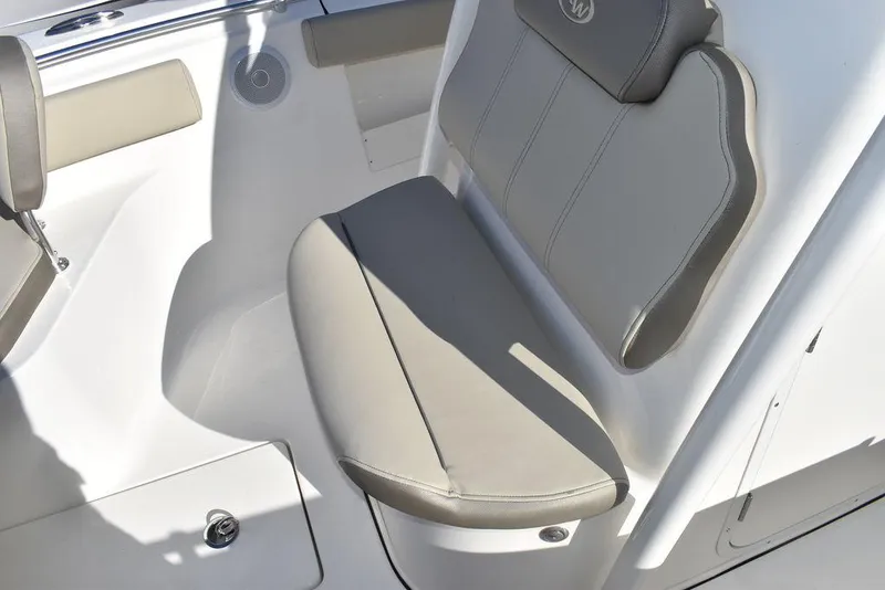 Slide: The Image of 2024 Key West 239 FS boat interior seating with cushioned bench and storage. - 42