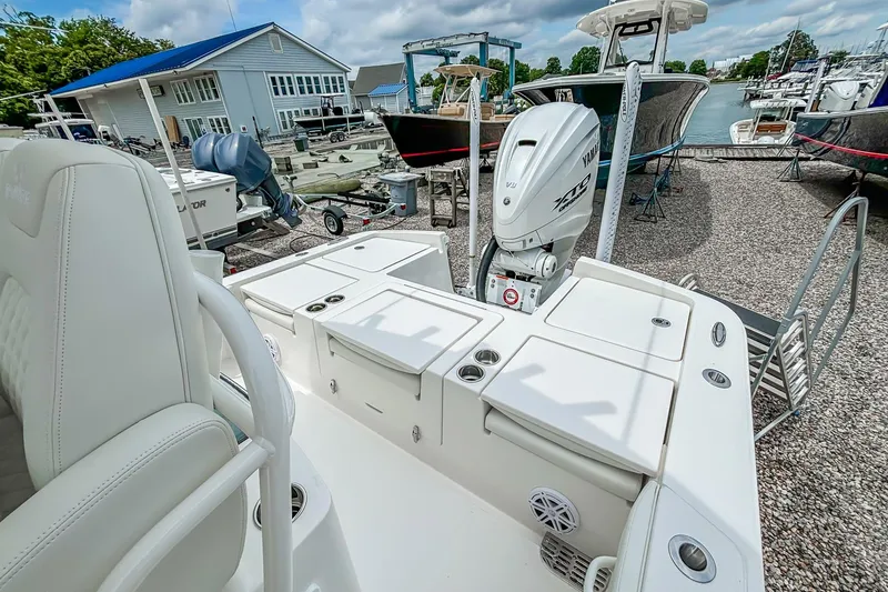 Slide: The Image of 2025 Regulator 26XO boat with Yamaha V8 engine, docked at a marina. - 24