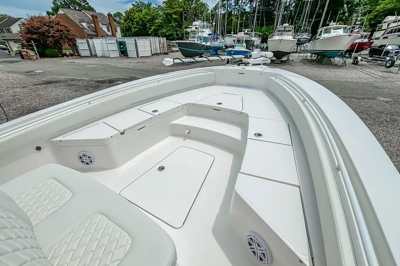 Slide: The Image of 2025 Regulator 26XO boat interior with spacious seating and storage compartments. - 28
