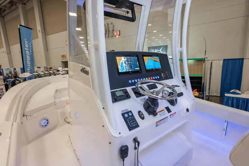 Slide: The Image of 2025 Regulator 26XO boat dashboard with advanced navigation system and sleek design. - 7