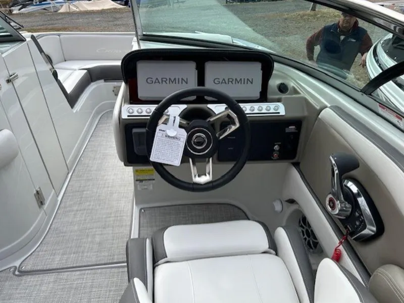 Slide: The Image of 2024 Crownline E Series E235 boat cockpit with Garmin navigation system. - 5