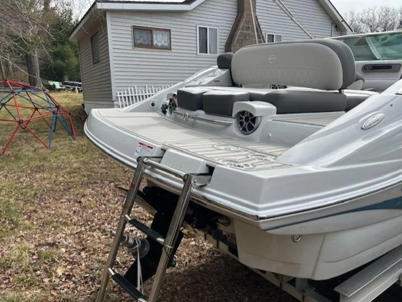 Slide: The Image of 2024 Crownline E Series E235 boat with swim platform and ladder. - 8