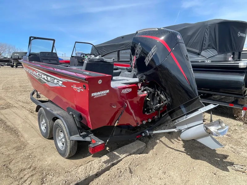 Slide: The Image of 2024 Tracker Targa V-19 Combo boat with powerful outboard motor on a trailer. - 5