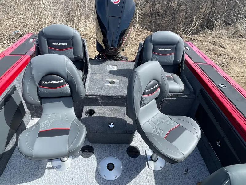 Slide: The Image of 2024 Tracker Targa V-19 Combo boat interior with four seats and motor. - 6