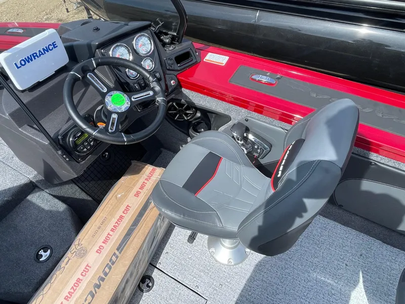Slide: The Image of 2024 Tracker Targa V-19 Combo boat interior with steering wheel and captain's chair. - 8