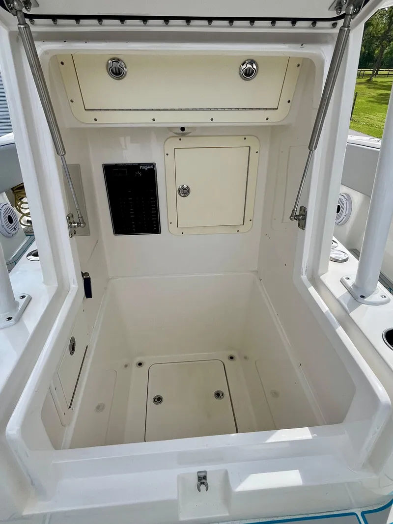Slide: The Image of 2016 Invincible 33' Open Fisherman storage compartment with access panels. - 15
