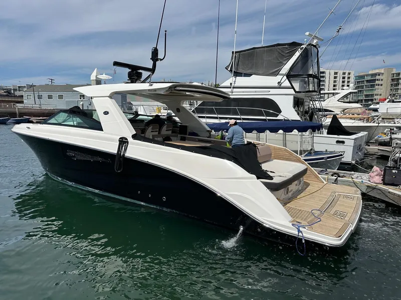 Slide: The Image of 2018 Sea Ray SLX 400 luxury boat docked at marina. - 0