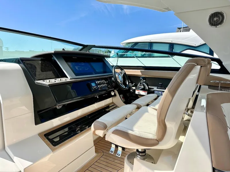Slide: The Image of 2018 Sea Ray SLX 400 helm with modern controls and luxurious seating. - 17