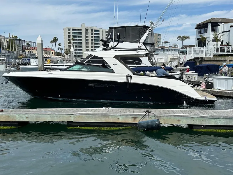 Slide: The Image of 2018 Sea Ray SLX 400 yacht docked at a marina. - 30