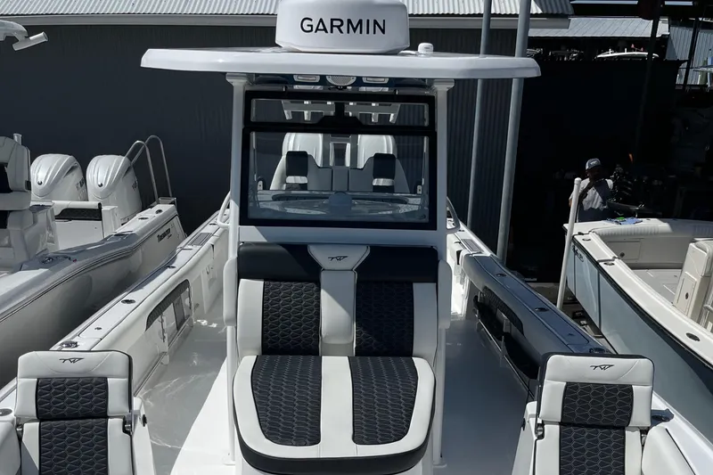 Slide: The Image of 2025 Tidewater 3100 Carolina Bay boat with Garmin navigation system. - 12