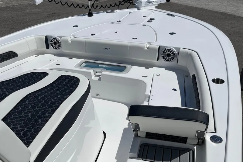 Slide: The Image of 2025 Tidewater 3100 Carolina Bay boat interior with seating and storage compartments. - 15