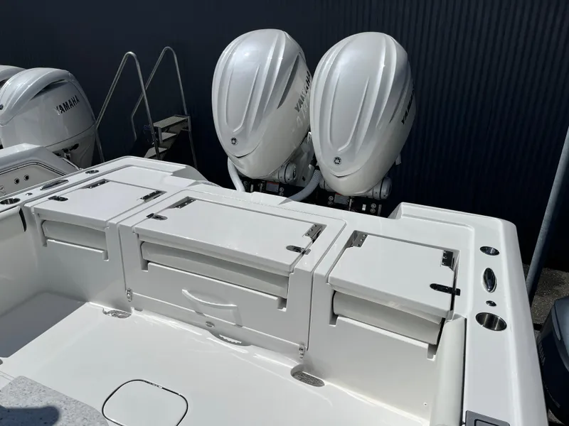 Slide: The Image of 2025 Tidewater 3100 Carolina Bay boat with dual Yamaha outboard engines. - 6