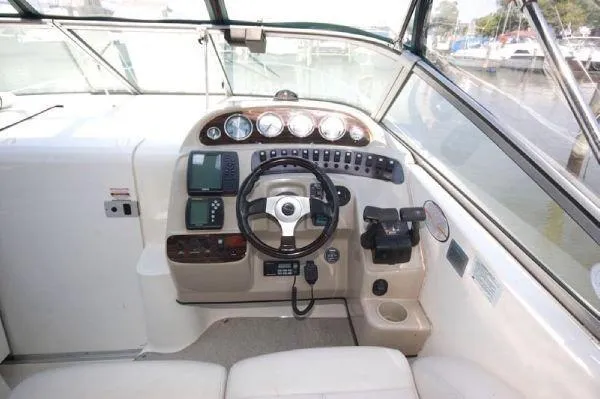 Slide: The Image of 2000 Chaparral 300 Signature boat helm with steering wheel and instrument panel. - 3