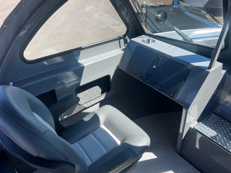 Slide: The Image of Interior of 2024 Fish Rite 200 Sportsman boat with seating and dashboard. - 11