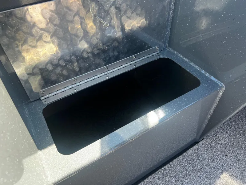 Slide: The Image of Open storage compartment on a 2024 Fish Rite 200 Sportsman boat. - 13