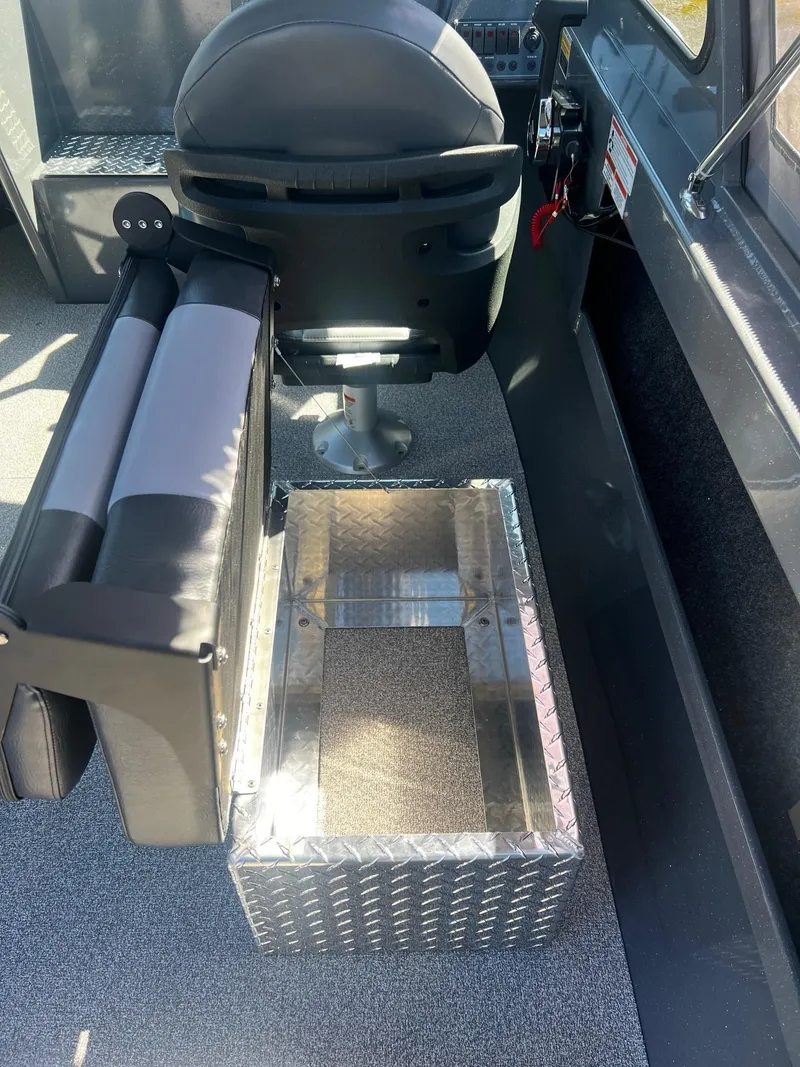 Slide: The Image of 2024 Fish Rite 200 Sportsman boat interior with seating and storage. - 16