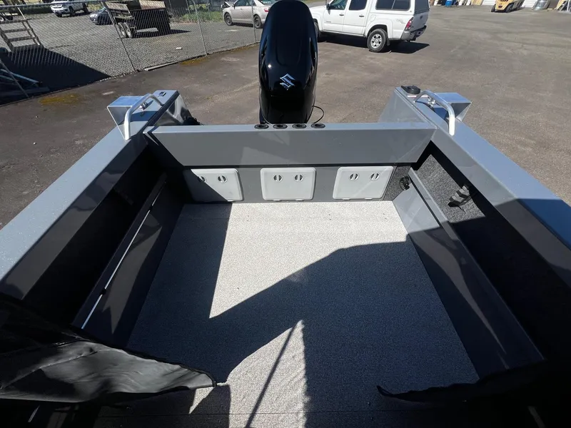 Slide: The Image of 2024 Fish Rite 200 Sportsman boat interior with Suzuki outboard motor. - 20