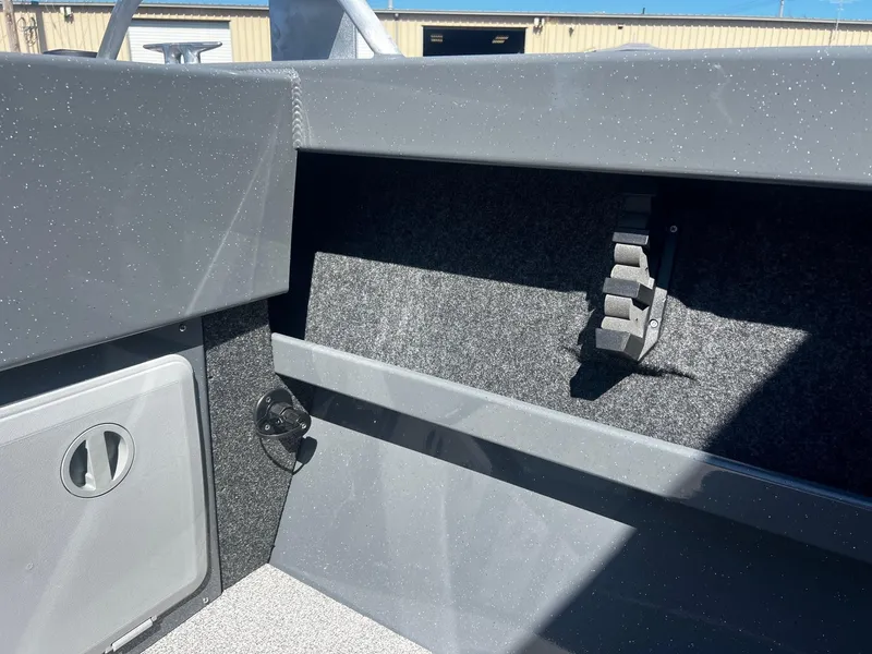 Slide: The Image of Interior view of 2024 Fish Rite 200 Sportsman boat showing storage compartment. - 22