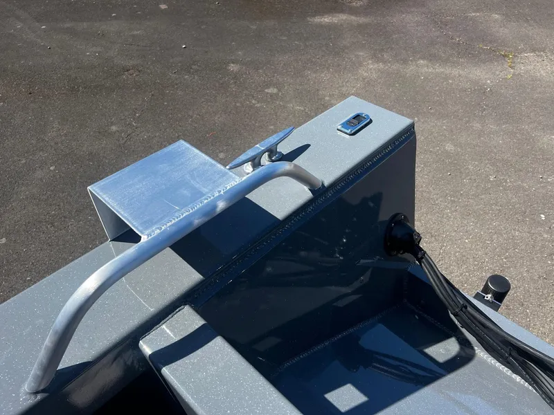 Slide: The Image of 2024 Fish Rite 200 Sportsman boat detail showing a cleat and railing on a gray deck. - 23