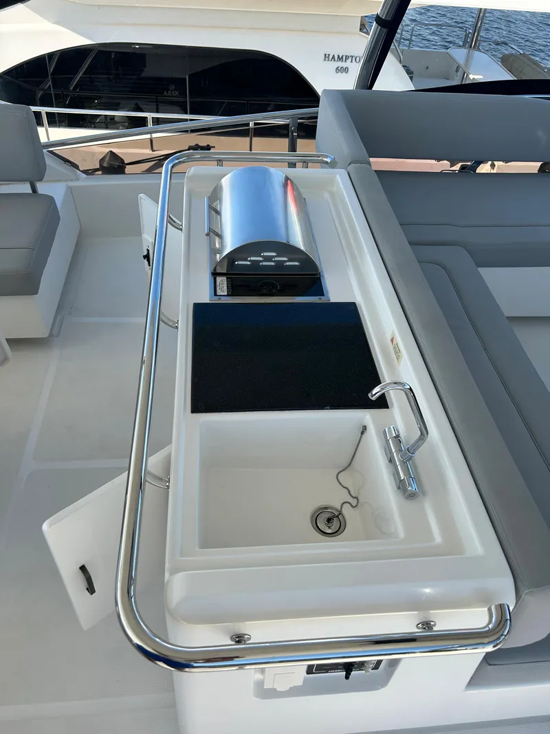 Slide: The Image of Aquila 44 Yacht 2020 deck with sink and grill setup. - 28