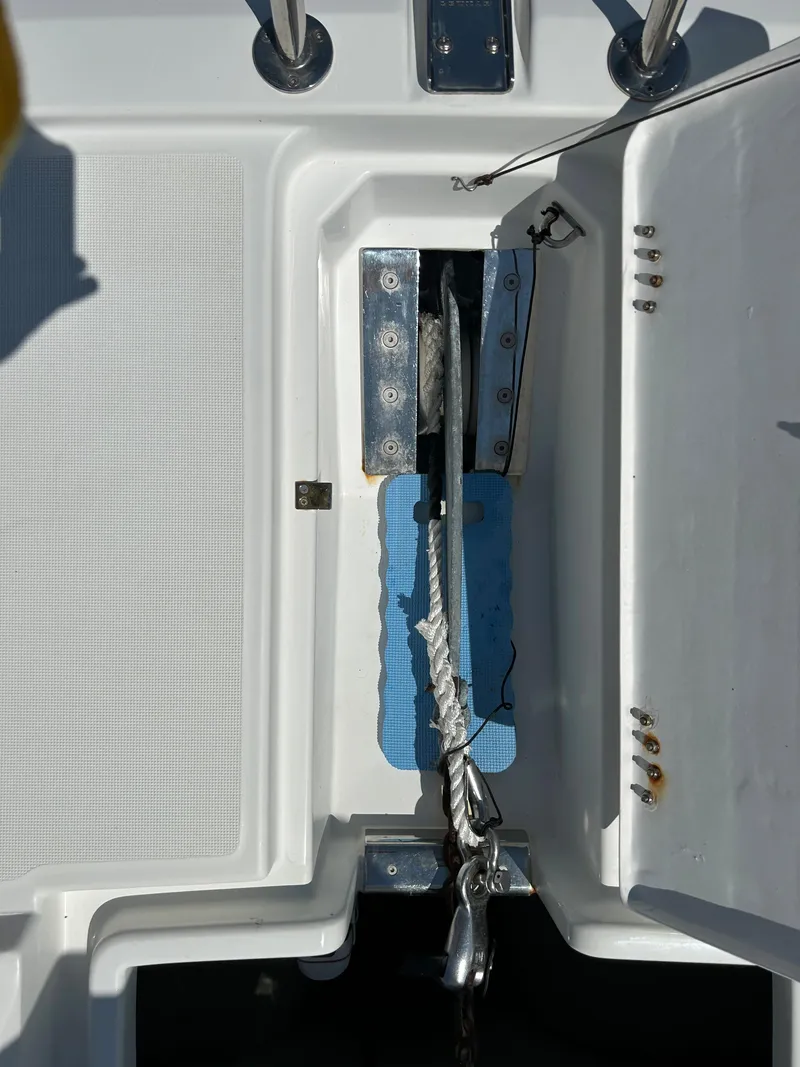 Slide: The Image of Anchor compartment of 2020 Aquila 44 Yacht with open hatch and visible rope. - 30