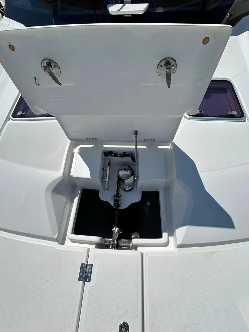 Slide: The Image of Aquila 44 Yacht 2020 anchor compartment with open hatch and visible mechanisms. - 31