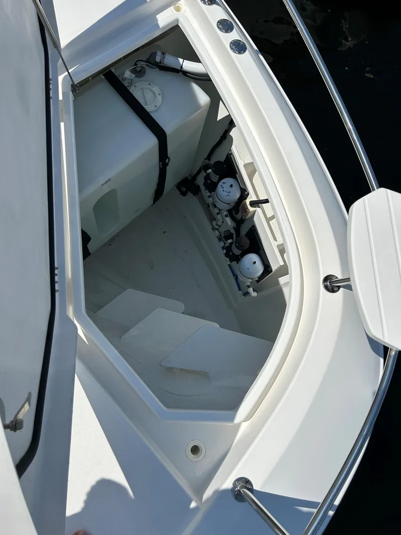 Slide: The Image of Aquila 44 Yacht 2020 storage compartment with equipment and clean white interior. - 33