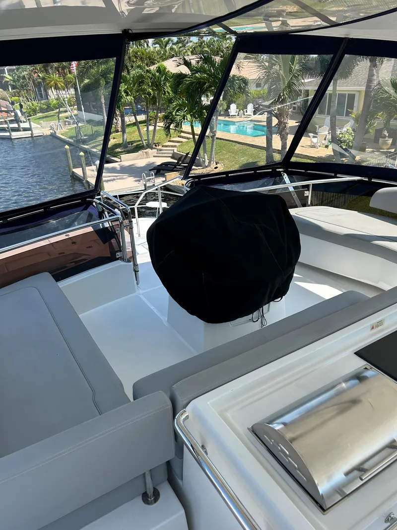 Slide: The Image of 2020 Aquila 44 Yacht interior with modern seating and waterfront view. - 34