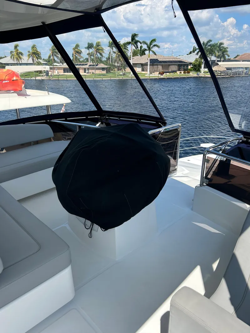Slide: The Image of 2020 Aquila 44 Yacht interior with waterfront view and modern seating. - 36