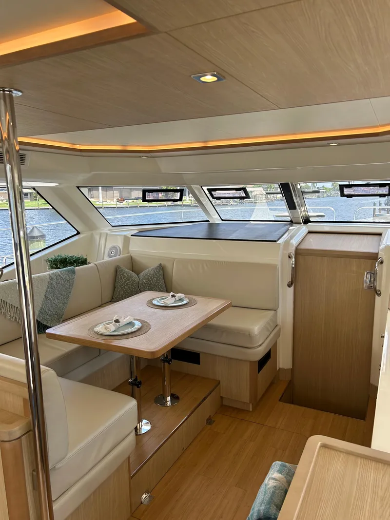 Slide: The Image of Luxurious interior of 2020 Aquila 44 Yacht with elegant dining area and scenic windows. - 45