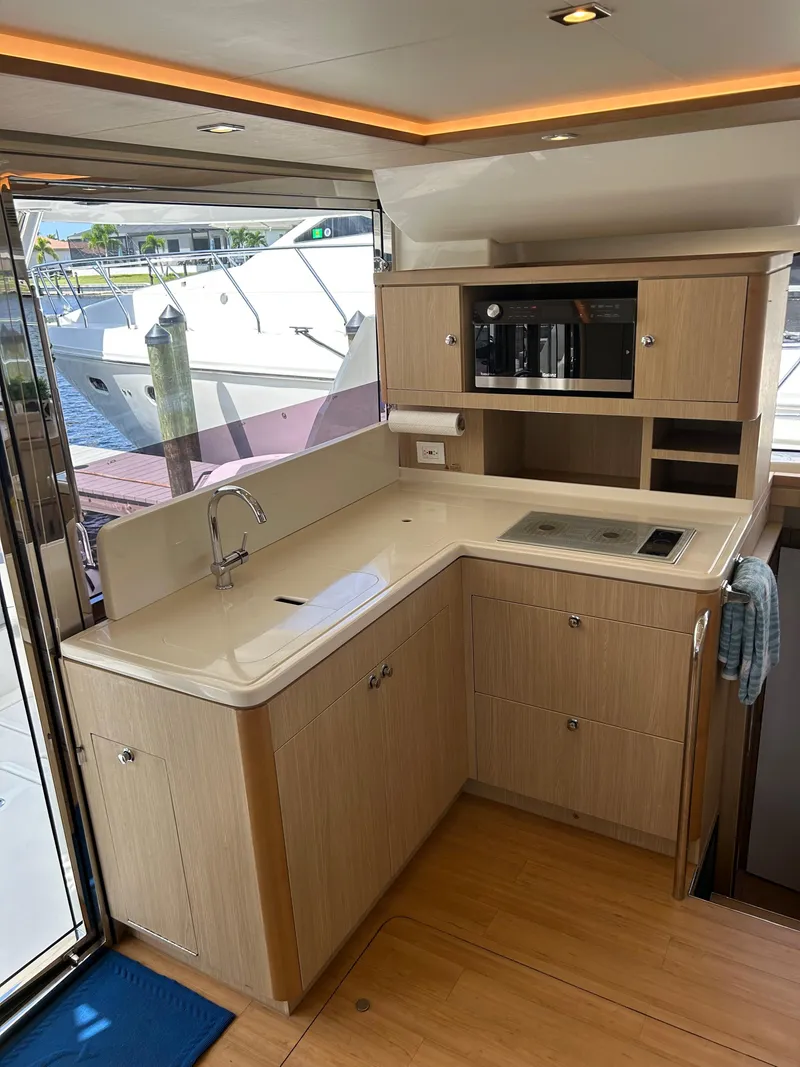 Slide: The Image of Modern kitchen interior on 2020 Aquila 44 Yacht with sleek cabinetry and appliances. - 48