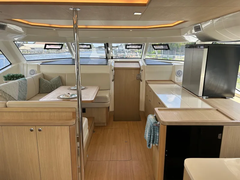 Slide: The Image of Interior of 2020 Aquila 44 Yacht with modern kitchen and dining area. - 49