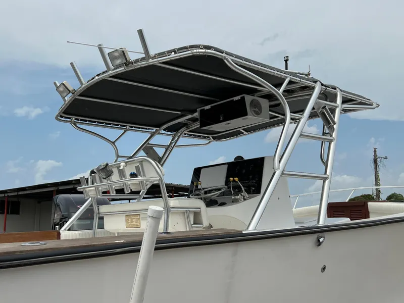 Slide: The Image of 2000 Stuart Angler 32 Center Console boat with T-top and navigation equipment. - 12
