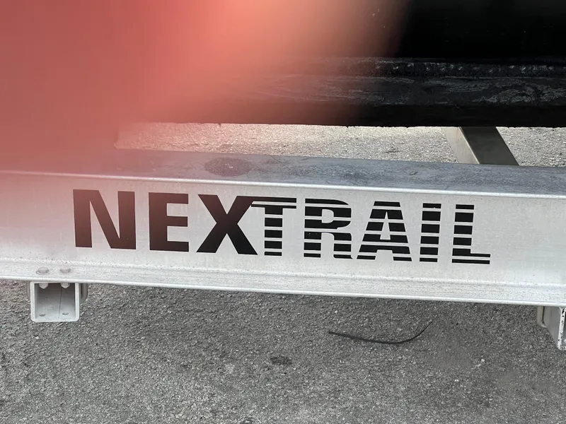 Slide: The Image of NextTrail trailer for Stuart Angler 32 Center Console/Cutty, 2000 model, on concrete surface. - 15