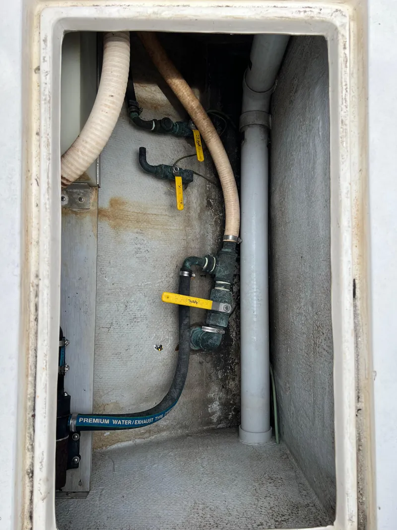 Slide: The Image of Interior view of a 2000 Stuart Angler 32 Center Console boat plumbing system. - 30