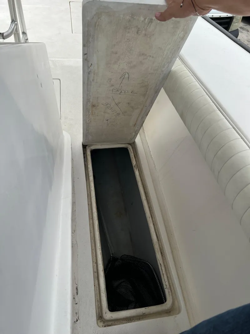 Slide: The Image of Open storage compartment on 2000 Stuart Angler 32 Center Console boat. - 32