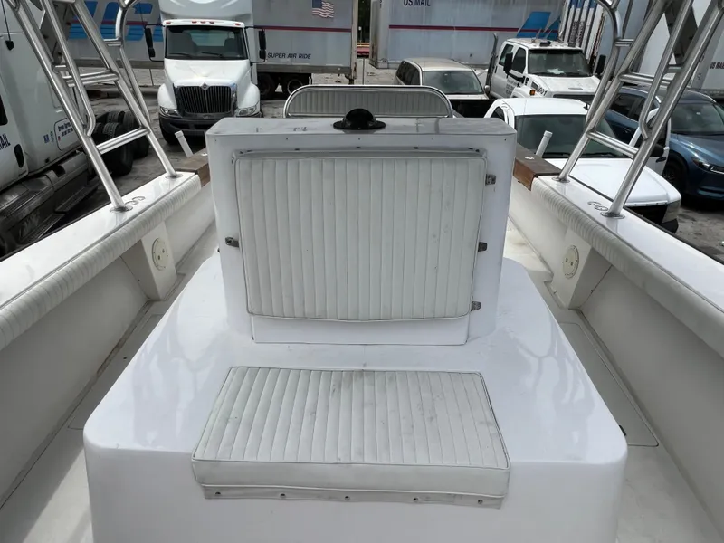 Slide: The Image of 2000 Stuart Angler 32 Center Console boat interior with seating and storage compartments. - 34