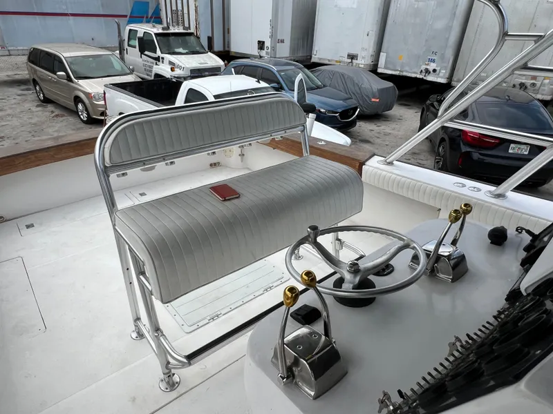 Slide: The Image of Stuart Angler 32 Center Console boat interior with steering wheel and seating, 2000 model. - 41