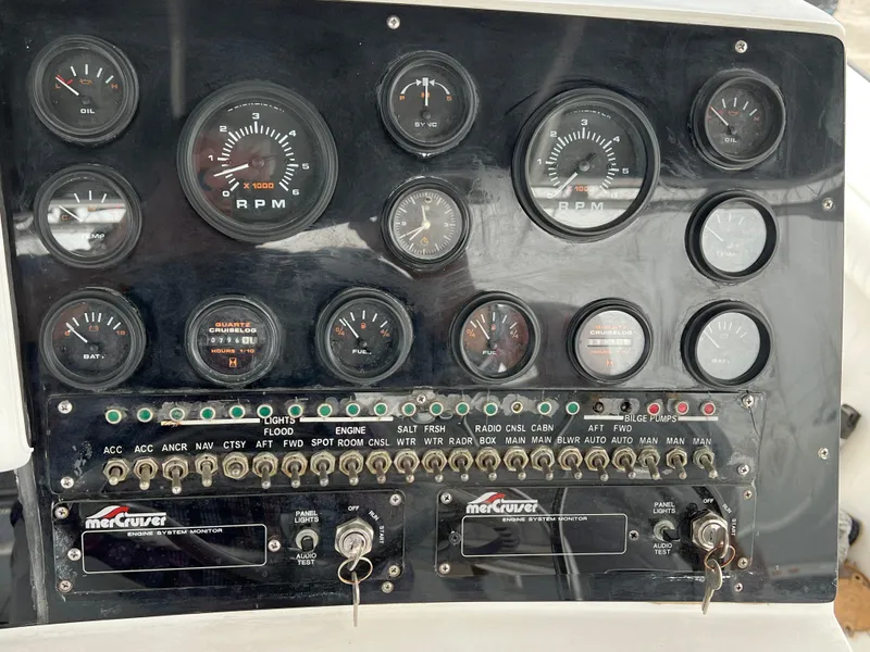 Slide: The Image of Instrument panel of a 2000 Stuart Angler 32 Center Console/Cutty boat with gauges and switches. - 47