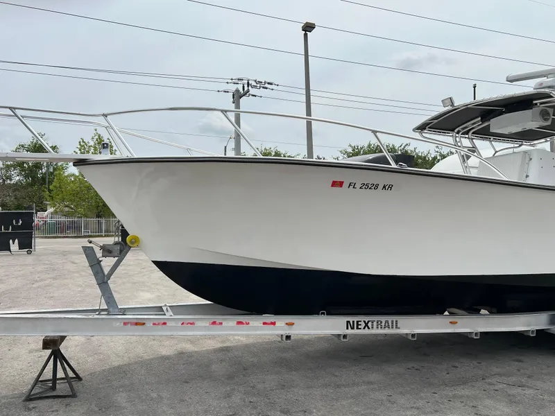 Slide: The Image of 2000 Stuart Angler 32 Center Console boat on trailer, side view. - 5