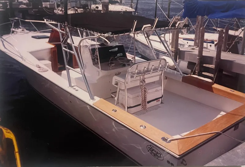 Slide: The Image of 2000 Stuart Angler 32 Center Console/Cutty boat docked at marina. - 7