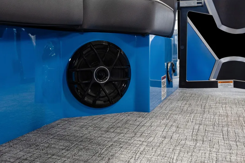 Slide: The Image of 2025 Trifecta 25 Sport RF9 DC 3.0+ boat interior speaker and seating detail. - 24
