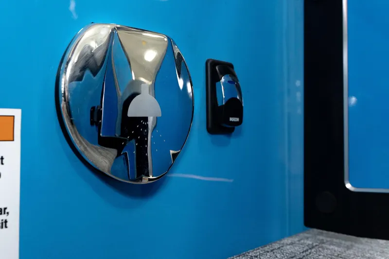 Slide: The Image of Close-up of 2025 Trifecta 25 Sport RF9 DC 3.0+ fuel cap and switch on blue exterior. - 26