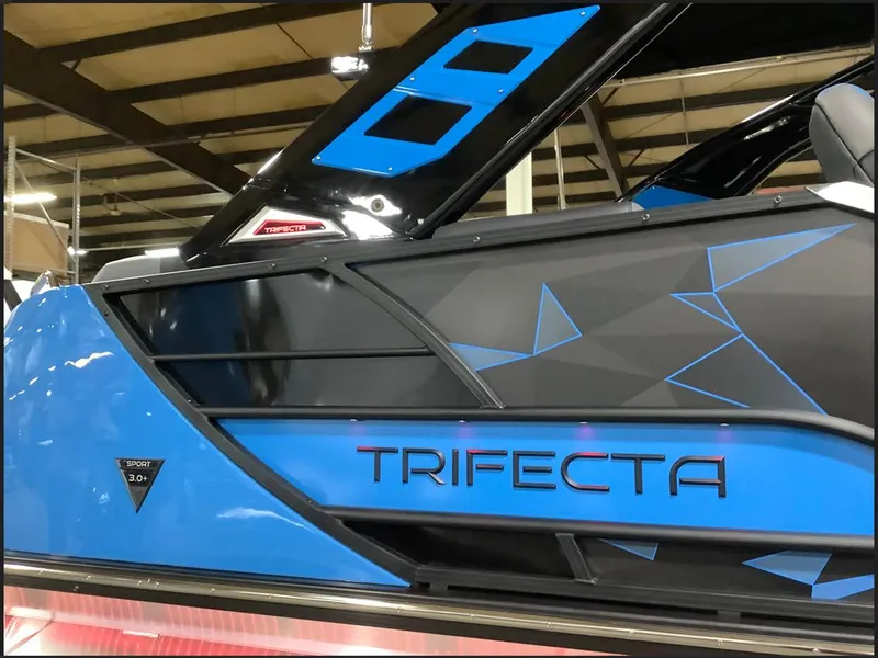 Slide: The Image of 2025 Trifecta 25 Sport RF9 DC 3.0+ boat, close-up side view with branding. - 5