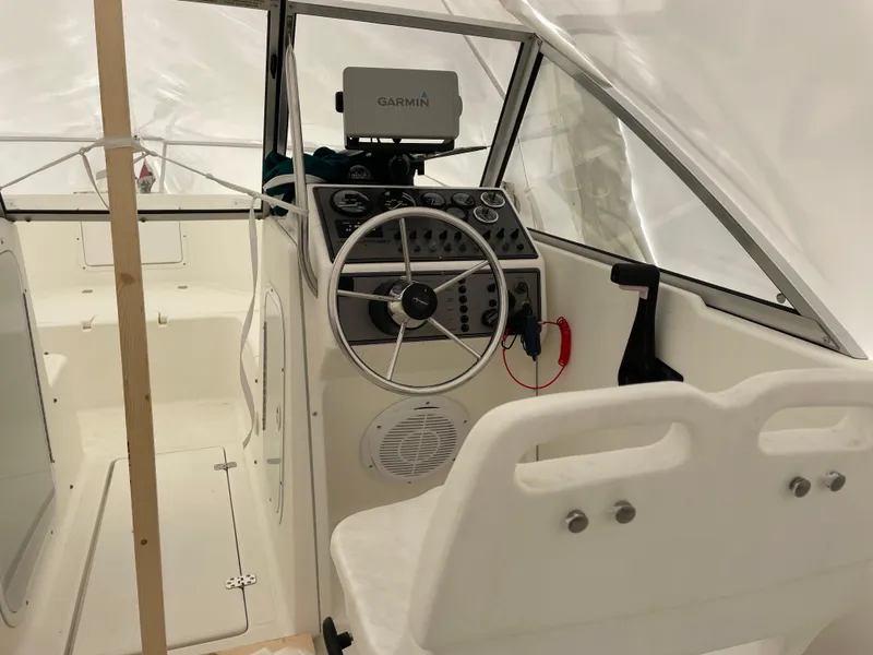 Slide: The Image of Interior of a 2000 Aquasport Osprey Sport 21.5 boat with Garmin navigation system. - 3