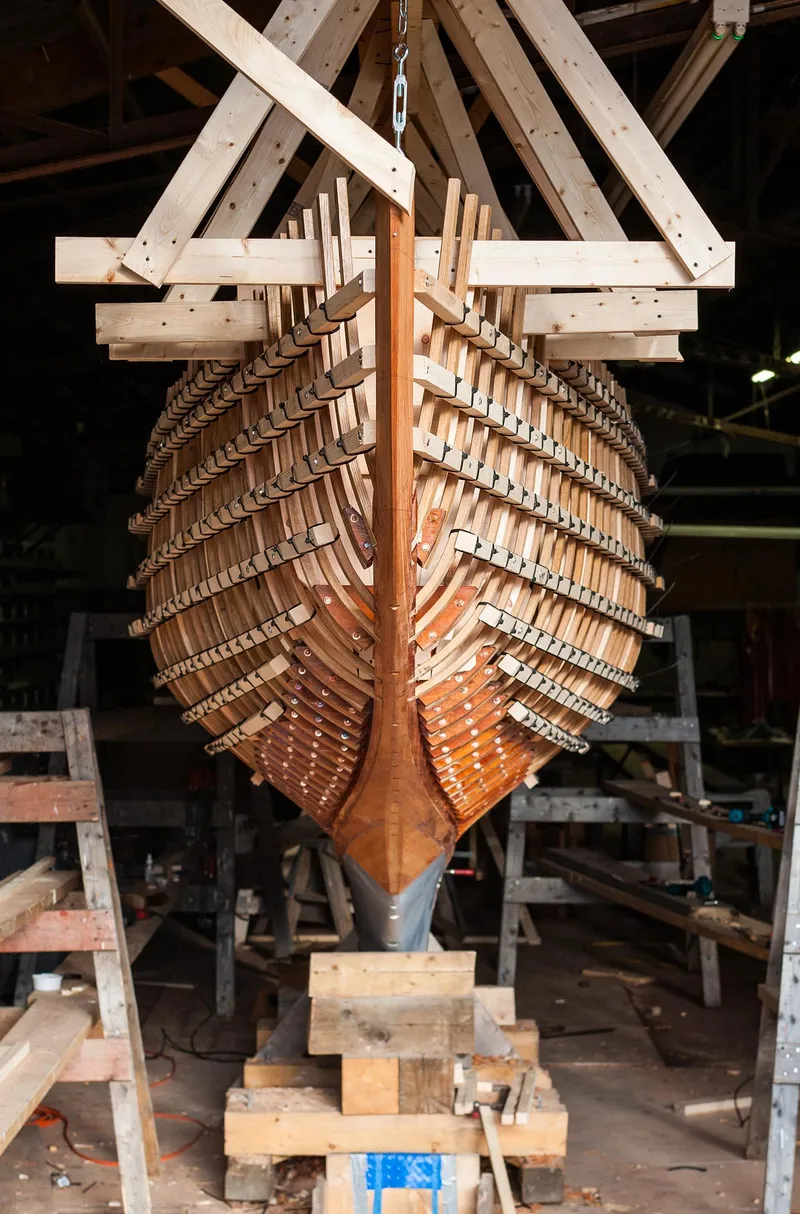 Slide: The Image of 1931 Sparkman & Stephens 36 Sloop under restoration in a workshop. - 16